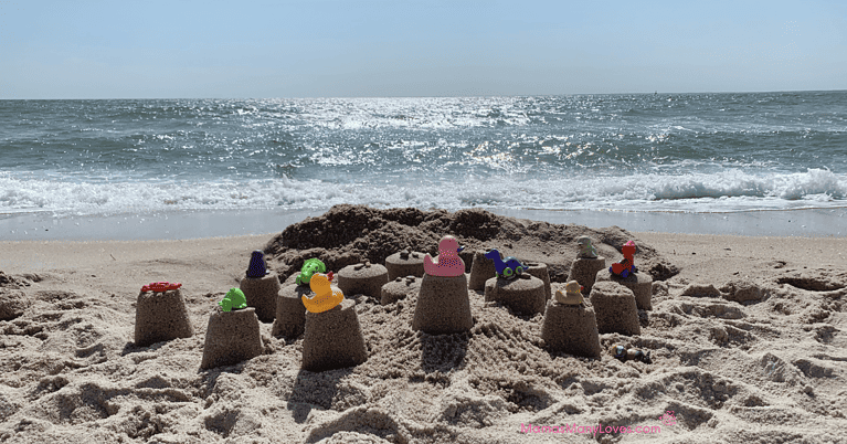 Picture of a sand castle with kids beach toys on Old Silver Beach, Falmouth, Massachusetts