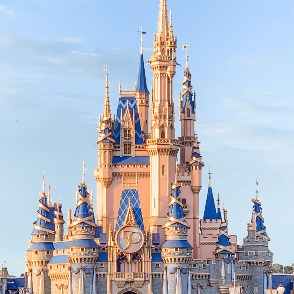 Photo of Cinderella's Castle at Walt Disney World with pink 50th Anniversary decorations