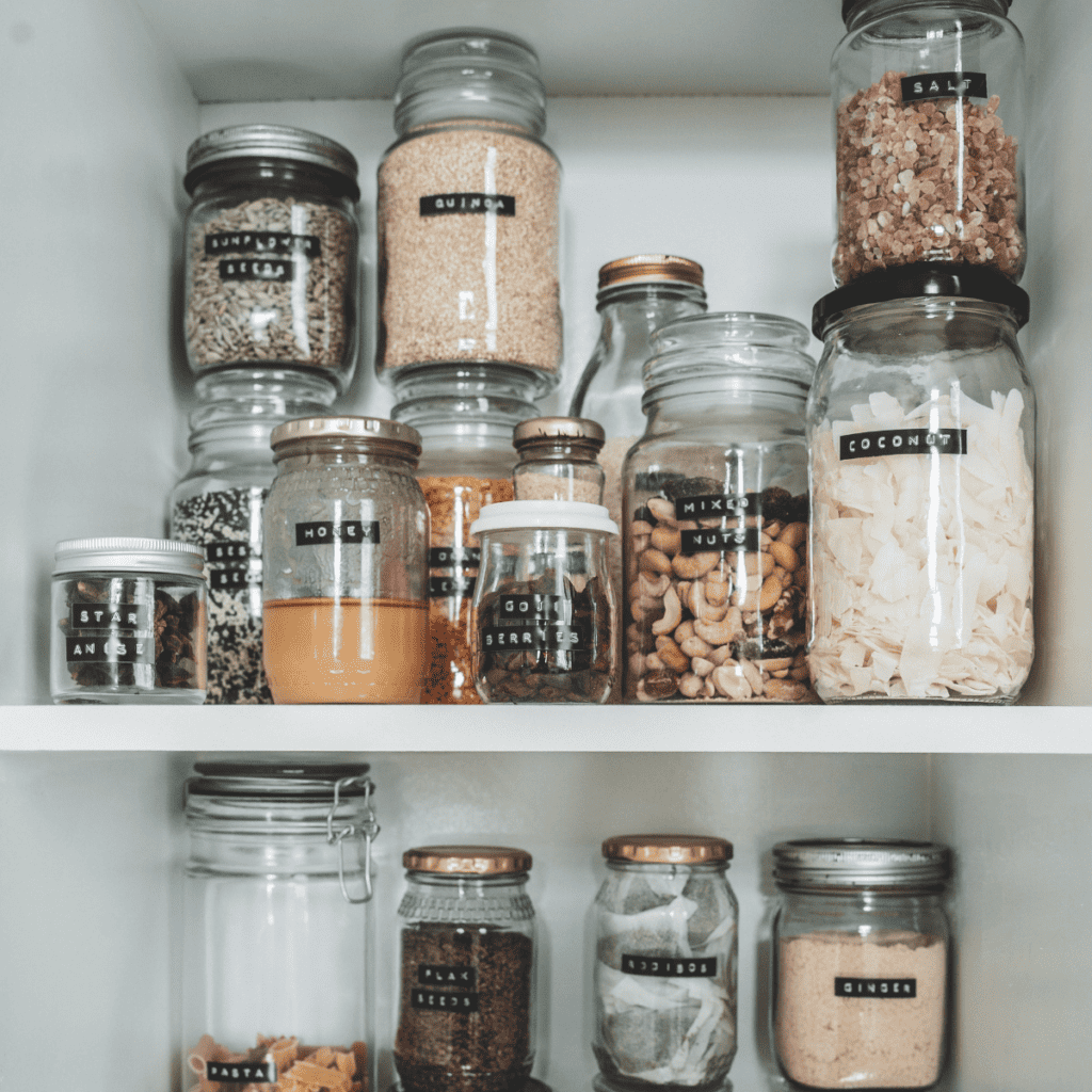 photo of a small pantry with spices in clear jars