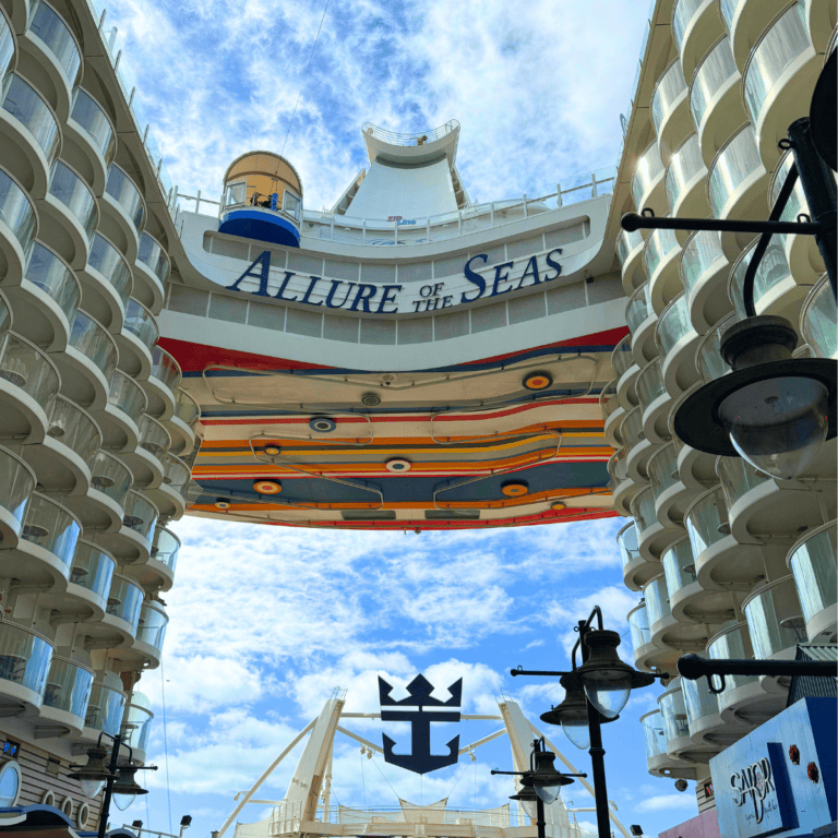 Photo of the Allure of the Seas from the Boardwalk. Featured image for blog post "40+ Things to do on Allure of the Seas with Kids [2024]."